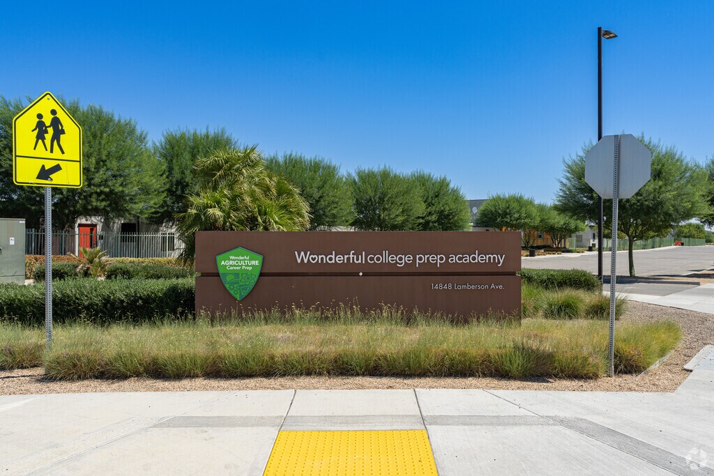 A large sign at the entrance to Wonderful College Prep Academy welcomes students.