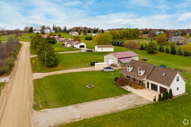 These Oregon Township homes with farmhouse styling are on Bronson Lake's northern edge.