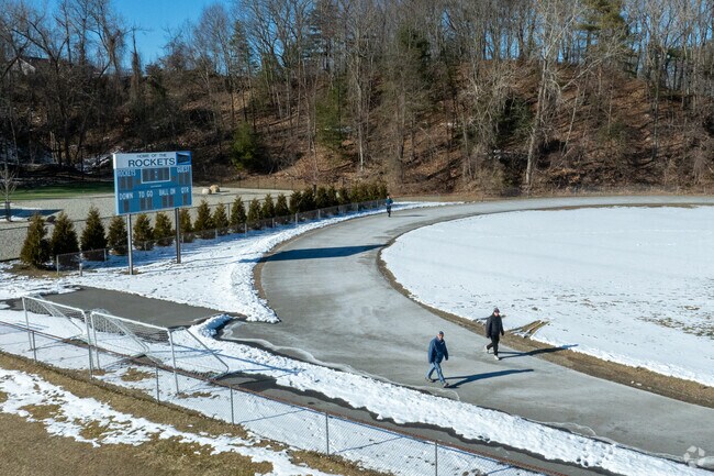 A few folks walk the track at Lemansky Park in Stoneville.
