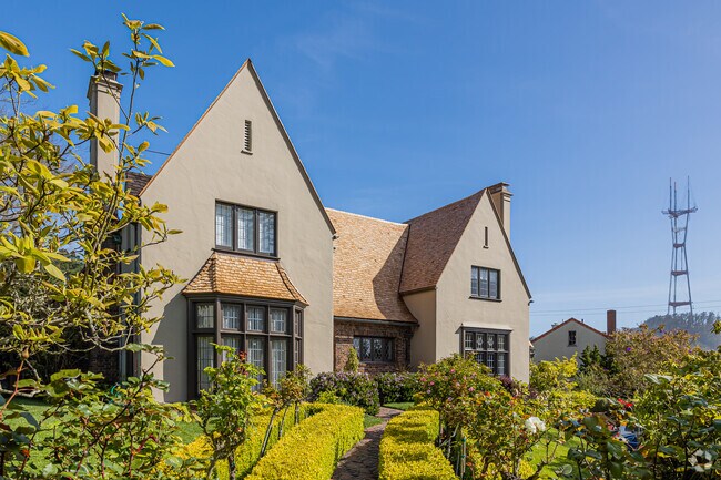 With a lush green yard, this Tudor-style home has one of the best views of the Sutro Tower.