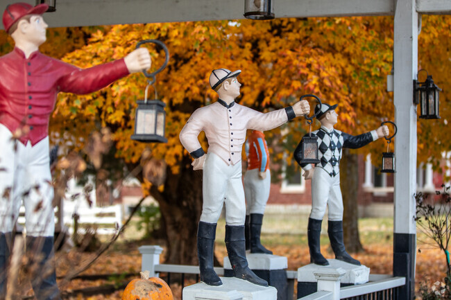 Horse jockey statues line the rail at Golden's Pub & Deli in Southeast Scott County.
