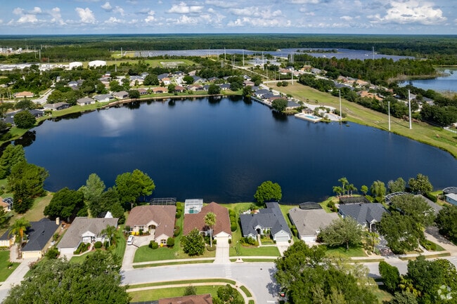 Beautiful aerial view of Waterfront ranch-style homes in Debary Country Club.