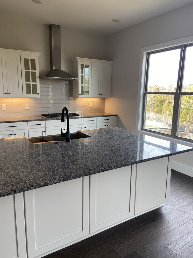 granite countops with glass cabinets