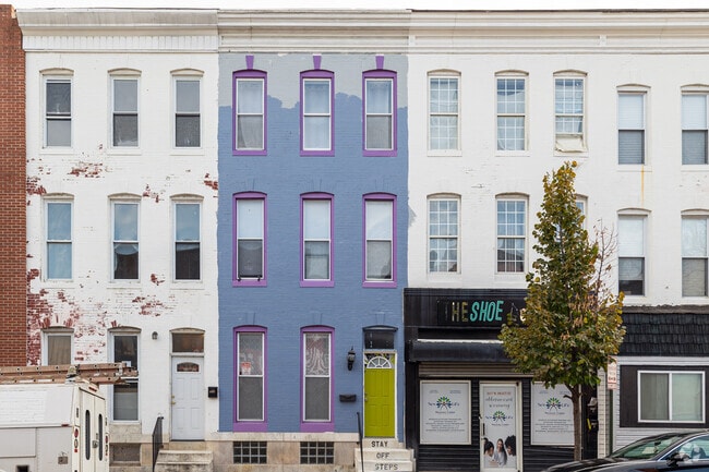 Three-story brick rowhomes line the edges of Carrollton Ridge.