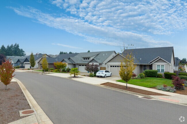 Fall colors creep in along contemporary homes on Summit View Ave SE in South Gate.