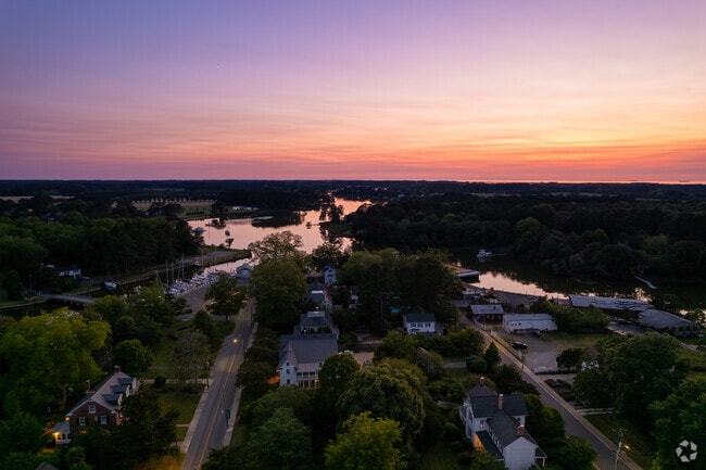 An aerial view of Onancock at sunset shows its proximity to Onancock Creek and Chesapeake Bay.
