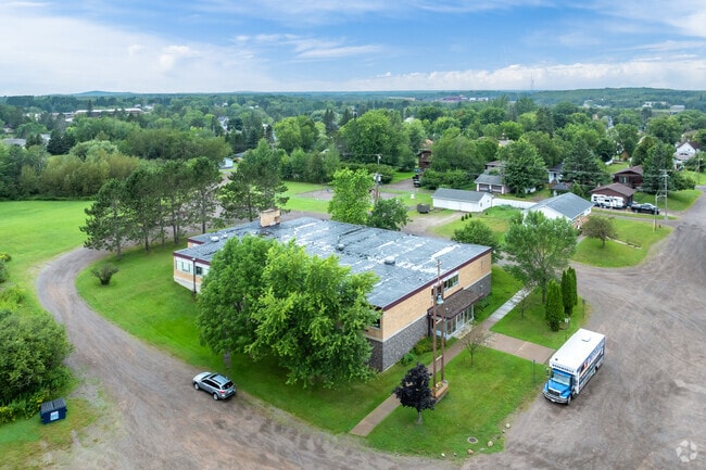 Follow the gravel road to St. Rose School.