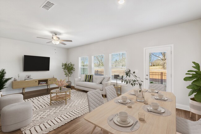 Living room with large window letting in a ton of natural light.