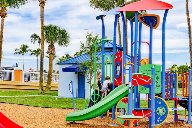 A mother and her toddler enjoy the playground in Ocean Breeze.