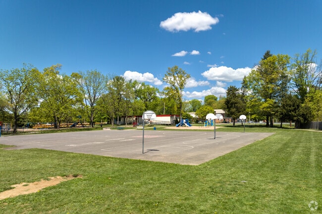 Exterior view of Blue Bell Elementary's basketball courts and playground area.
