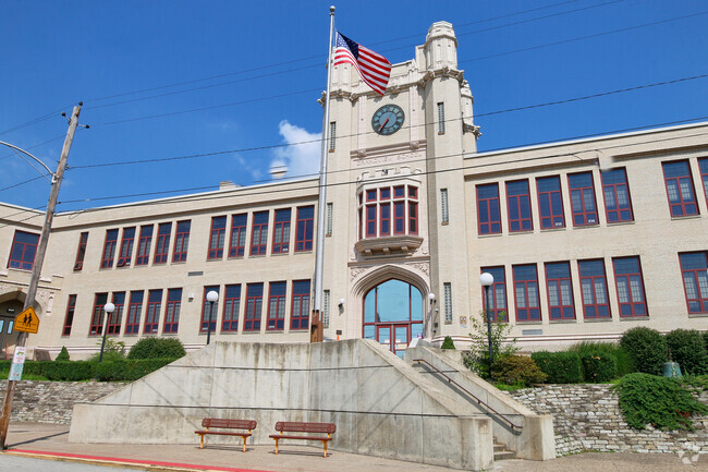 A great clock stands above the entrance of Highlands Elementary School.