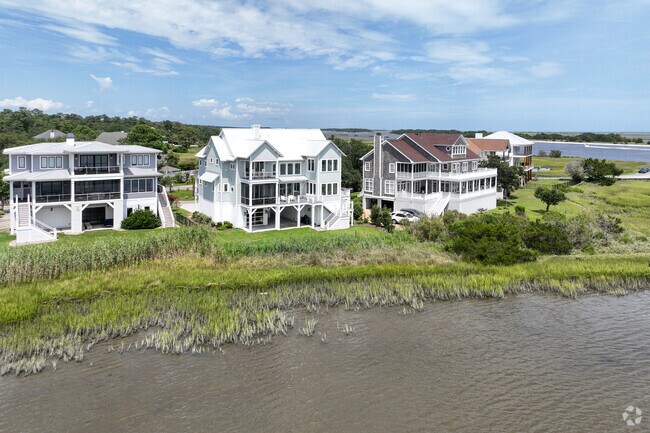 Custom waterfront homes line the coast of Sea Breeze.