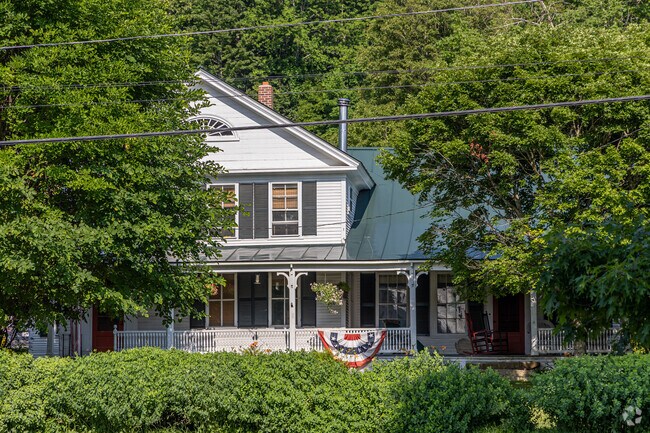 Homes in Strafford often have front porches with well landscaped yards.