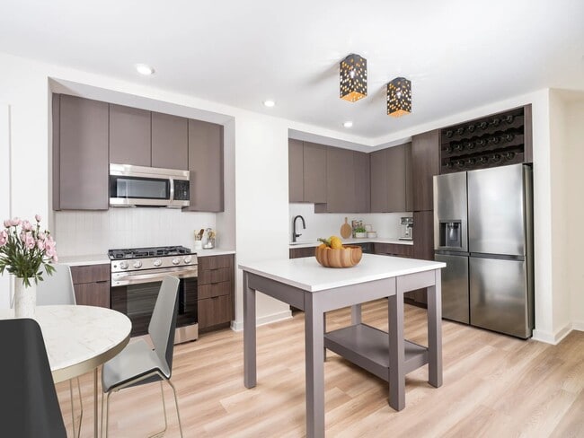 Discover your dream home at Modera Parkside! Our premium collection homes feature elegant under-cabinet kitchen lighting, distinctive fixtures, upgraded countertops, a stylish tile backsplash, and a captivating two-tone cabinet finish that elevates your living experience in Midtown Atlanta.