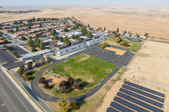 Juliet Thorner Elementary maximizes space with playgrounds inside the track field.