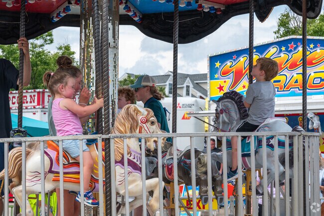 Kids don't want to get off the merry-go-round at Scituate Heritage Days.