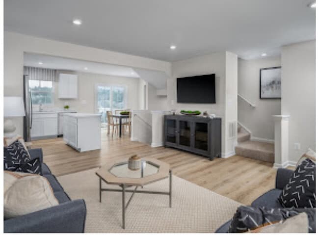 Open kitchen dining living area sliding door to deck looking out into nature 1.2bathe
