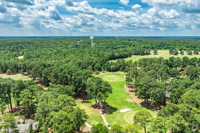 Golf fairways weave through towering pines on a championship course in Pinehurst.