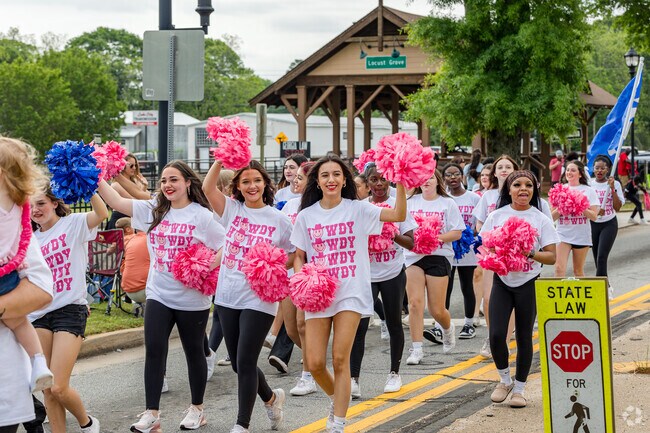 Locust Grove High School cheerleaders show their colors during the Locust Grove Day Parade.