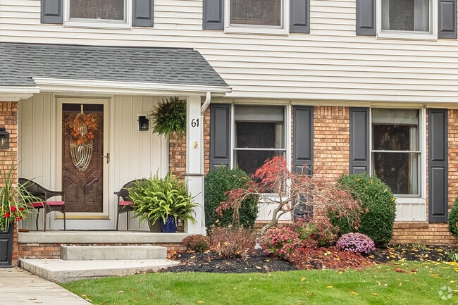A detailed view of a traditional porch and entrance of a home in Orchard Park, NY.