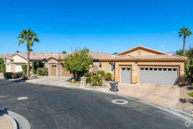 Row of traditional well kept homes in the gated community of Avondale.