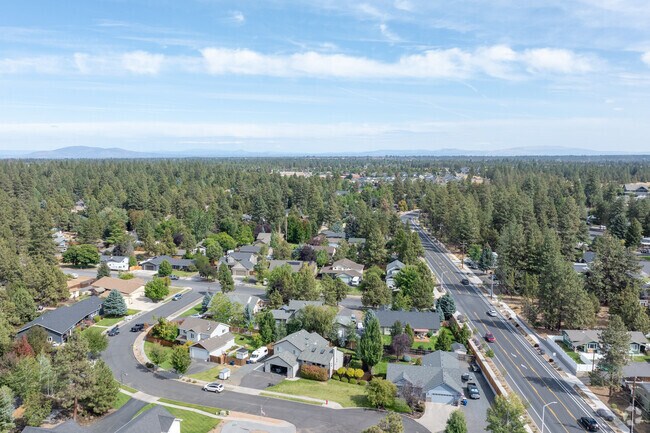 Drone shot of Southeast Bend, capturing a vibrant neighborhood with tree-lined streets.