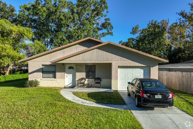 Mature trees and a clean exterior are features of this West Colonial single-family home.