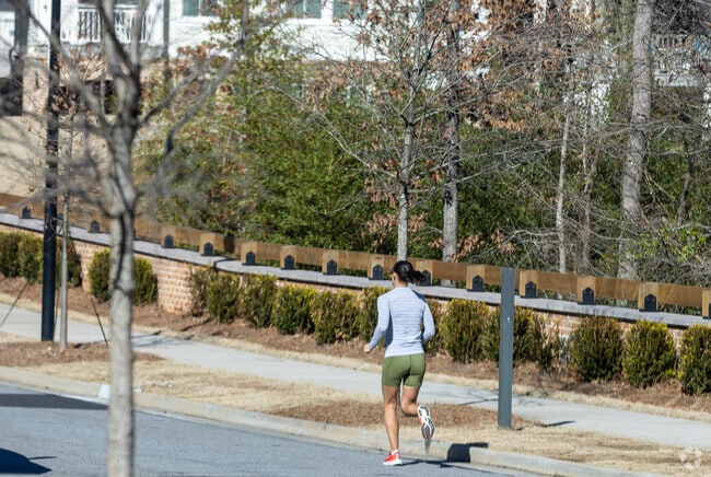 A woman running in downtown Milton, GA