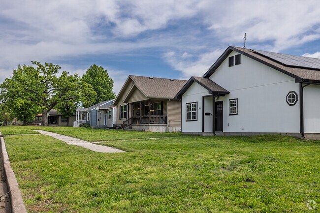 Older homes line a residential street in YMCA.