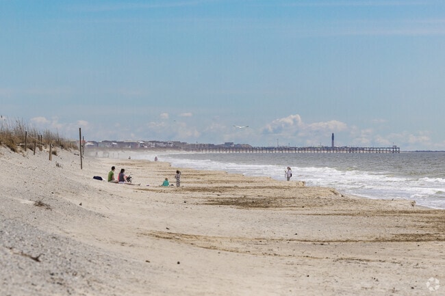 Saint James families enjoy going to Oak Island Beach for fun in the sun.