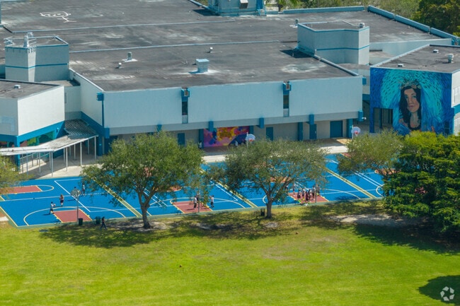 Students fill the basketball courts at Arvida Middle School during lively recess breaks.