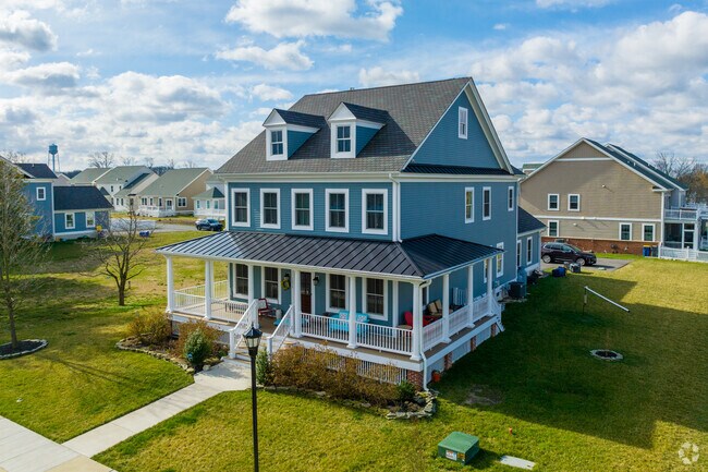 A new build Colonial home with a wide wrap around porch in Delaware City.