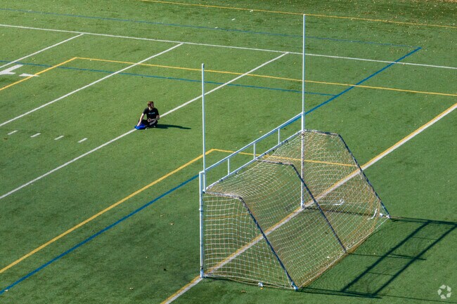 Players take a rest at Uptowns Cricket Hill soccer field.