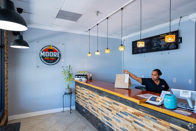 Moore Fire Grill near Coral Lake offers tasty Cajun and Southern cuisine.