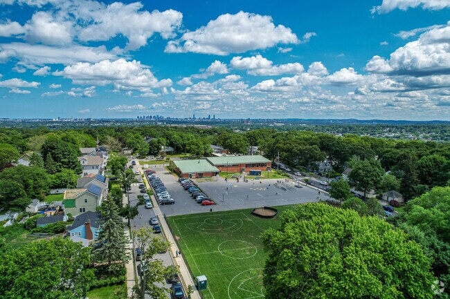M. Norcross Stratton Elementary School campus overview with Boston skyline in Arlington.