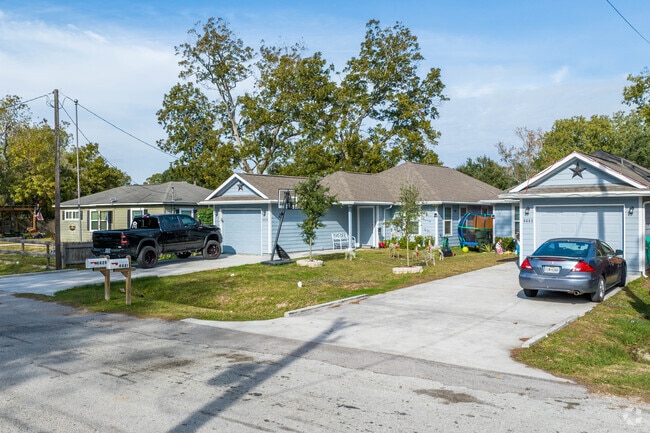 A row of single-story bungalows sits on a quiet cul-de-sac in Bacliff.