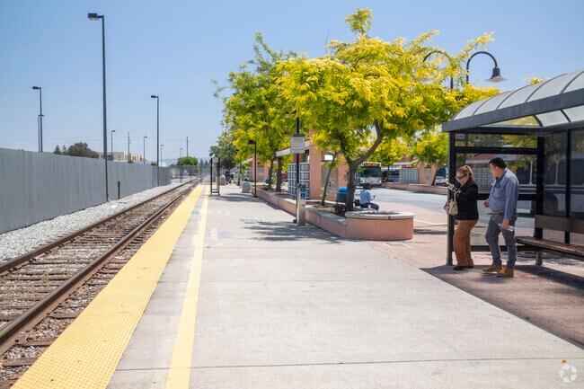 A couple waiting for the train at the Gilroy Station.