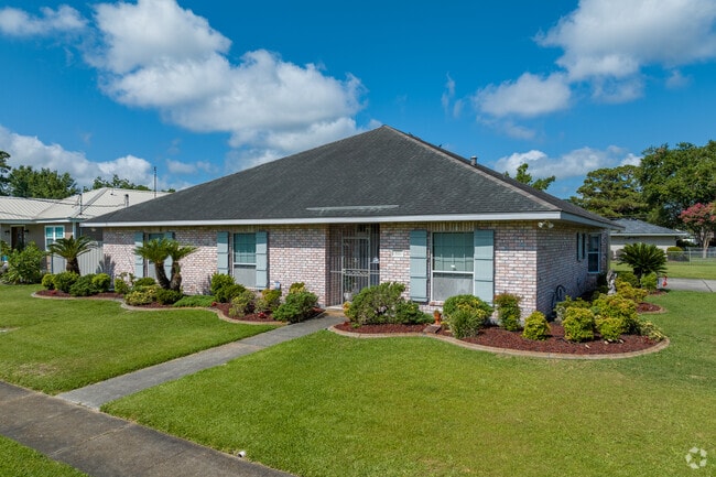 A well-kept brick home sits in the Harvey neighborhood.