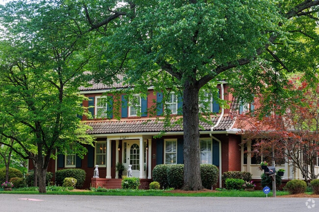 You can find the occasional Colonial Revival home on a wooded lot.