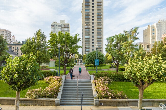 Residents walk their dogs though one of Downtown's many parks.