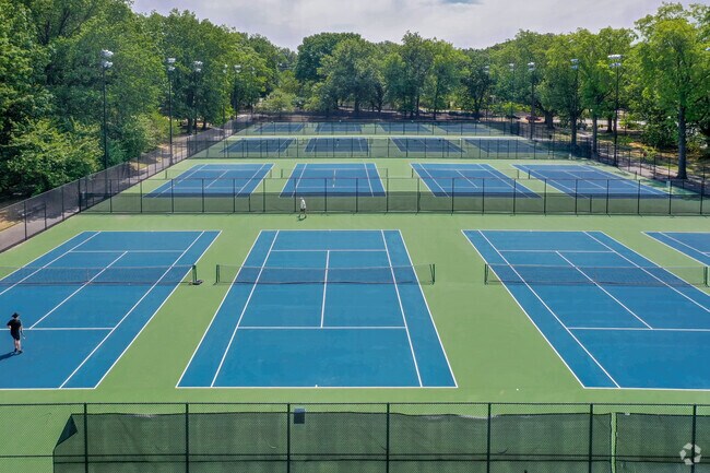 Catch of game of tennis with locals at Branch Brook Park.