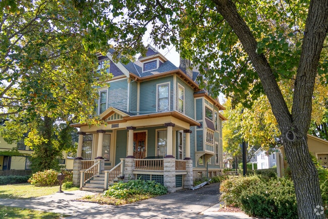 Colorful victorian style homes sit surrounded by mature trees in Look West.