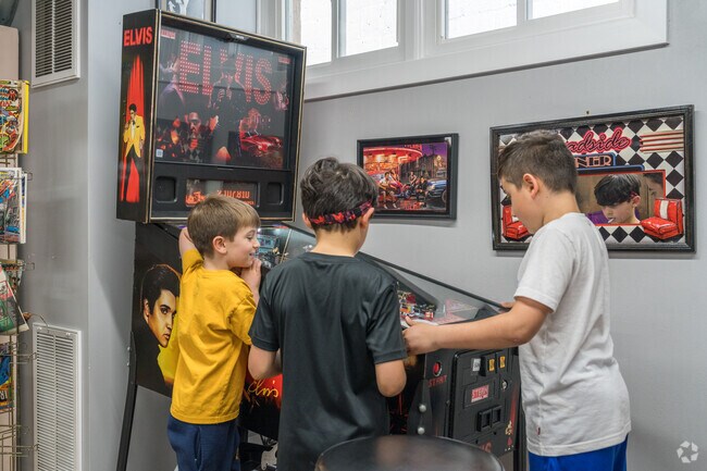 New Cumberland boys play arcade games at Hanna's Ice Cream Shoppe while waiting for a treat.