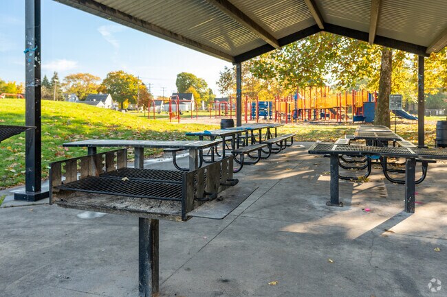 Residents enjoy a family BBQ at the Butler Playfield.
