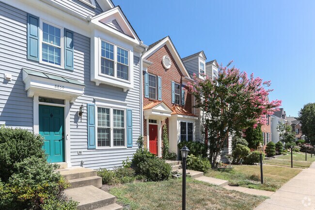 Kingsbrooke's inviting Townhomes with beautiful landscaping add to its suburban charm.