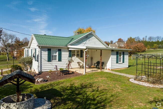 A charming, single-story cottage sits on a multi-acre lot in Peach Bottom.