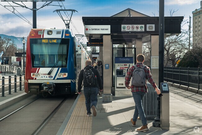 University of Utah students catch the Red Line on Trax in University.