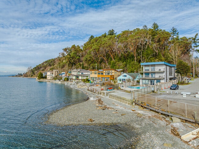 Modern comfort meets timeless beauty in these water front Arbor Heights homes.