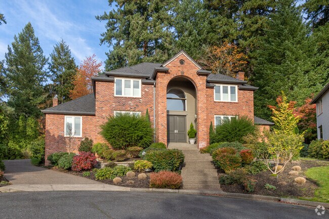 Enjoy privacy in this elegant brick home tucked on a Westridge cul-de-sac.