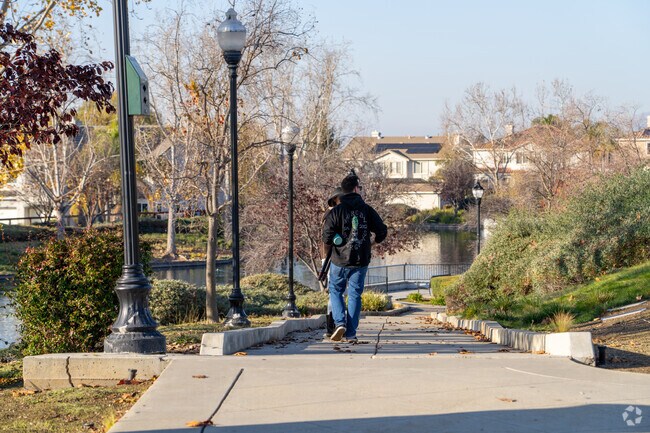Residents enjoy peaceful walks by the lake at Murillo Lake Park.